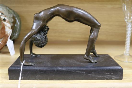 A bronze figure of an acrobat, signed Milo length 25cm
